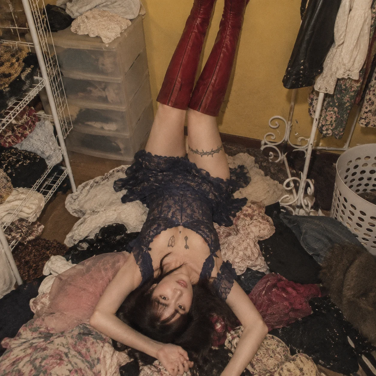 Upside Down Rock Idol among Clothing Debris